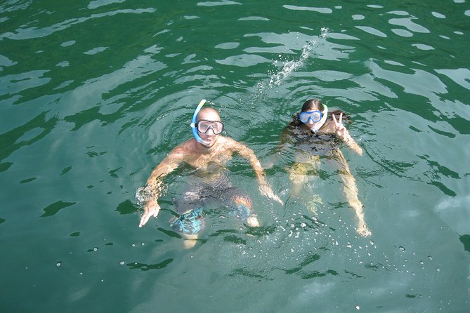 1 Day Boat Tour: HaLong Bay, Lan Ha Bay, Natural Beach and Full Moon Party - Setting out through Lan Ha Bay and the fisherman’s village