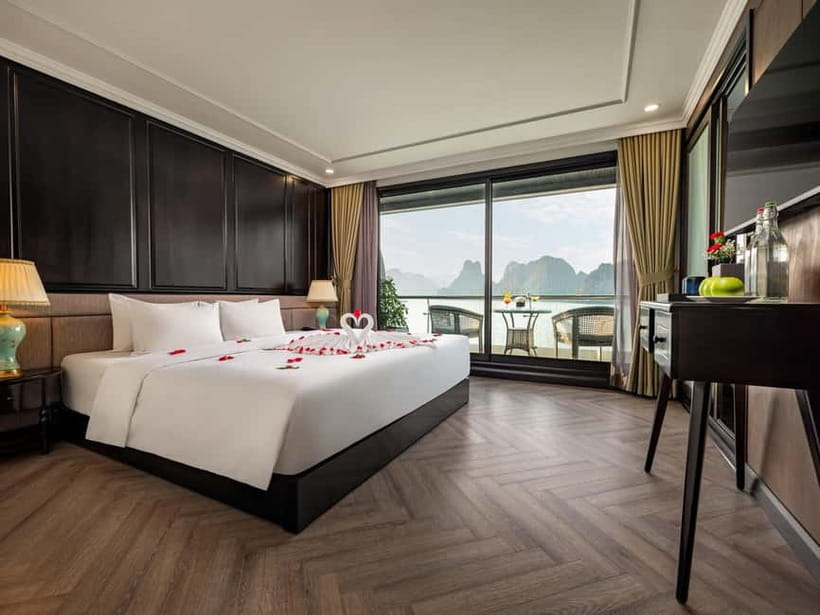 2-Day or 3-Day: Halong&Lan Ha Bay Cruise 5<em> balcony,bathtub – Five things to know before booking’ /></p>
<ul>
<li><strong>The two-night option adds Viet Hai Village:</strong> You can bike or take an electric car through village roads, visit a local family home, and spend more time around Lan Ha Bay.</li>
<li><strong>Cabins include a balcony and bathtub:</strong> This is useful when you want quiet time between scheduled activities.</li>
<li><strong>The Dark and Bright Cave visit is a strong final morning:</strong> Choose a kayak or a locally rowed bamboo boat.</li>
<li><strong>The Doria is large, modern, and clean:</strong> Some passengers receive a free upgrade when cabins are available.</li>
<li><strong>Transport needs careful checking:</strong> The shared limousine transfer is included only with the transfer option, and the trip from Hanoi can take around three hours before the boat connection.</li>
</ul>
<h2 id="what-the-148-price-really-covers">What the $148 price really covers</h2>
<p><img width="487" height="650" decoding="async" src=