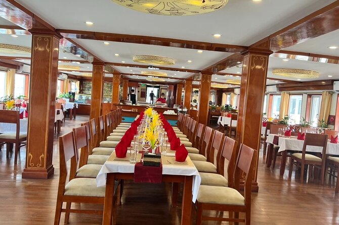 2D1N Ha Long Bay by Calypso Cruise, Caves, Meals, Transfer - Sunset, spring rolls, dinner, and squid fishing