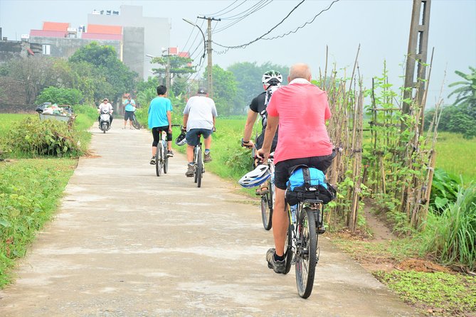 Bicycle Tours Hanoi: Full Day Bicycle Tour Hanoi Countryside - Starting at the bicycle shop and crossing Long Bien Bridge