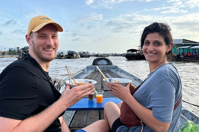 Can Tho: Floating Market, Canals, Nature Reserve & Forest - Reading Cai Rang Floating Market from a small boat
