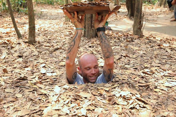 Cu Chi Luxury Group Tour - Tapioca and Cake Half Day - Hidden entrances, forest paths, and bomb craters