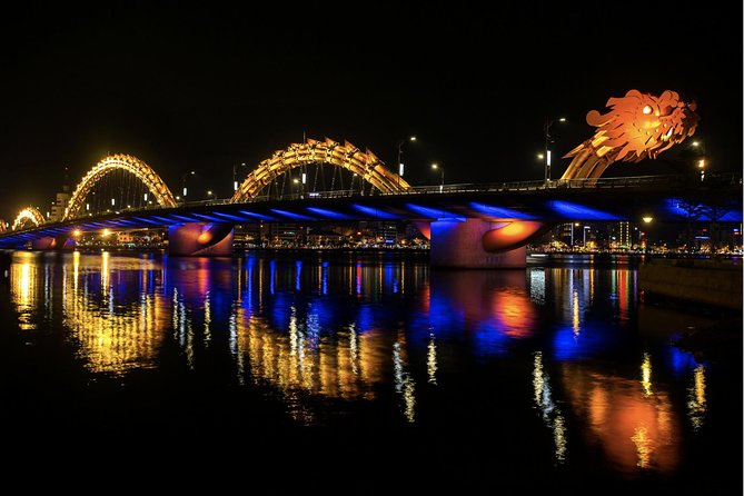 Da Nang By Night: Seafood dinner, night market and cruise trip - Riding through the city by motorbike