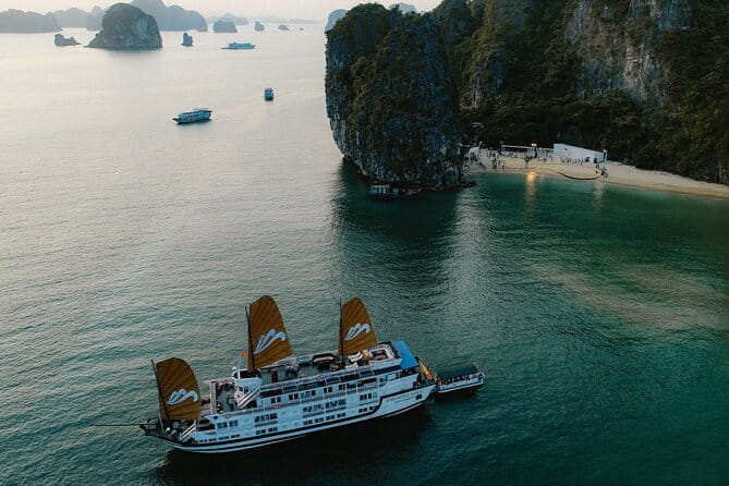 Emeraude Cruise 2 days 1 night Ha Long Bay Tour - Early morning coffee, yoga, and Sung Sot Cave
