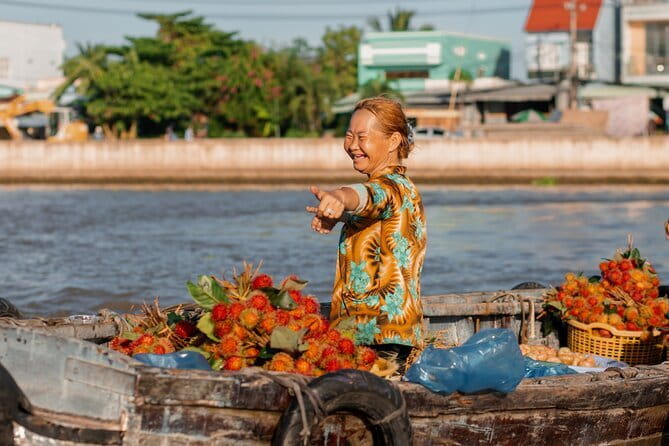 Floating Market & Hidden Canals – Small Group Morning Boat Tour - Cai Rang land market shows daily shopping on shore