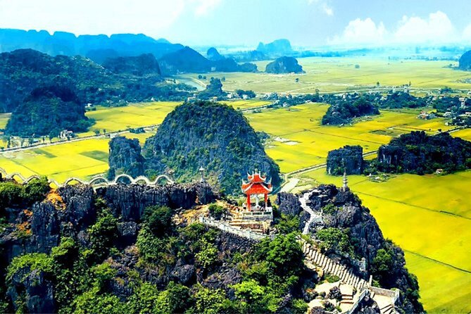 From Hanoi: Hoa Lu, Tam Coc, and Mua Cave Scenic Day Trip - Tam Coc by boat, with limestone cliffs overhead