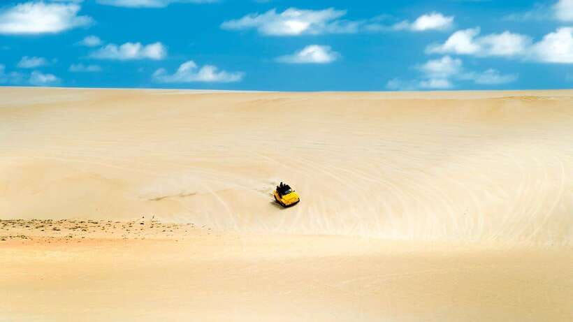 From HCM: Mui Ne Day Trip with Fairy Stream and Sand Dunes - Wind turbines, fishing village, and route changes