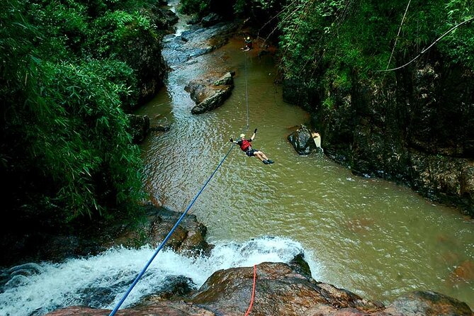 Full Day Canyoning Activity in Da Lat with Lunch - Crossing the waterfall on the Tyrolean Traverse