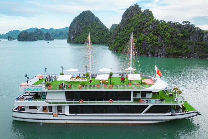 Halong Apollo 5<em> Cruise with Jacuzzi Day Trip And Buffet Lunch – Key points to know before booking’ /></p>
<ul>
<li><strong>A full Halong Bay day from Hanoi:</strong> You leave Hanoi in the morning and return to your hotel around the end of a 12-hour day.</li>
<li><strong>A 2024 five-star cruise boat:</strong> The boat includes a Jacuzzi and serves an Asian and European buffet lunch.</li>
<li><strong>Three main activities on the water:</strong> You can kayak or take a bamboo boat through Luon Cave, walk through Sung Sot Cave, and swim or climb at Ti Top Island.</li>
<li><strong>A maximum of 19 people:</strong> This is smaller than many large coach-and-boat day trips, which can make instructions and group movement easier.</li>
<li><strong>Guide Tommy receives especially warm praise:</strong> He is described as punctual, funny, clear in English, helpful with solo visitors, and good at taking photographs.</li>
<li><strong>Drinks cost extra:</strong> Lunch is included, but beverages at the meal are not.</li>
</ul>
<h2 id="is-the-60-price-good-value">Is the $60 price good value?</h2>
<p><img width="669" height="446" decoding="async" src=