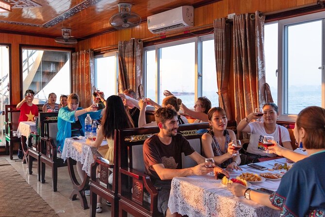 Halong Bay Day Tour With Titop Island, Cave, Kayak & Lunch - Sunset snacks and the ride back to Hanoi