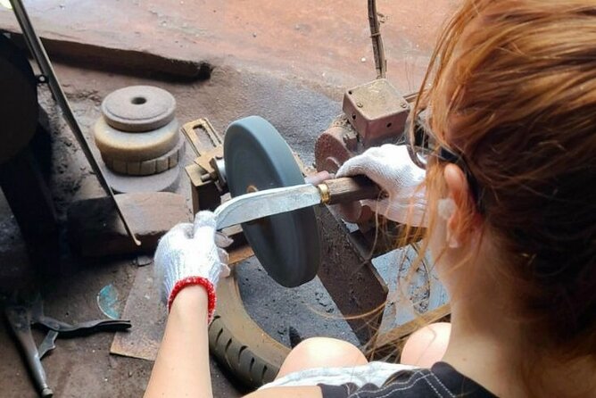 Hanoi Knife Making Traditional Workshop - Sharpening the blade and the tar-based wash