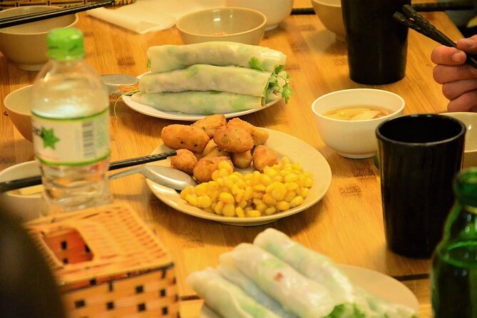 Hanoi Motorbike Tours Led By Women: Hanoi By Night Foodie Motorbike Tours - Long Bien Bridge and the city between meals
