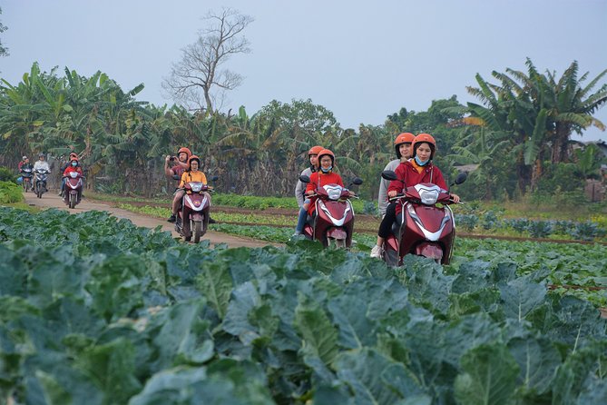 Hanoi Motorbike Tours Led By Women: Hanoi Outskirts & Rural Life - Crossing Long Bien Bridge beside the Red River