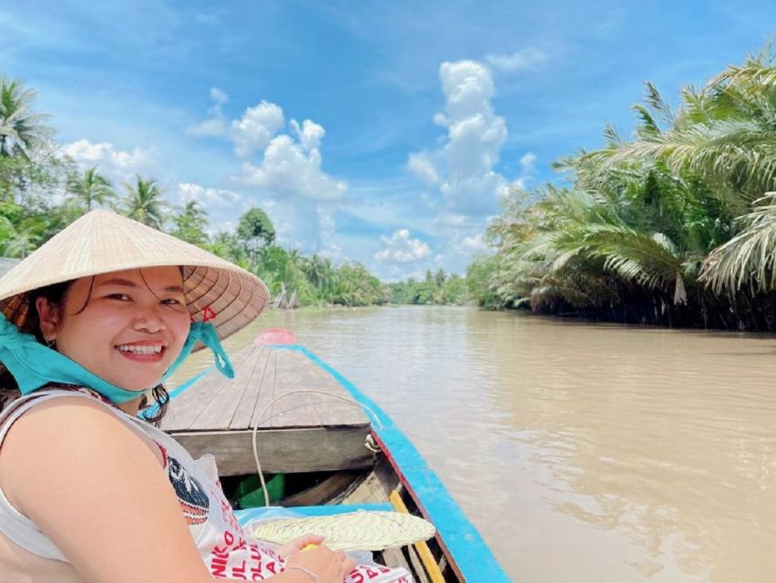 Ho Chi Minh City: Discover Mekong Delta & Coconut Village - The sampan through coconut-lined canals
