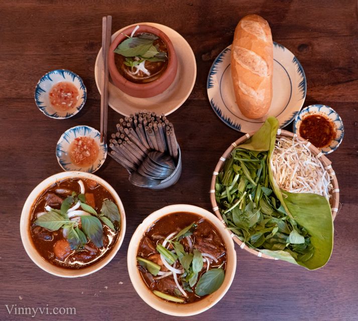 Ho Chi Minh City: Private Street Food Motorbike Tour - District 3, old buildings, and a pagoda in an apartment