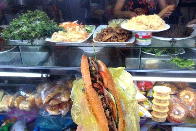 Hoi An at Sunset: Authentic Local Street Food Tour - Barbecue pork, rice paper, and herbs