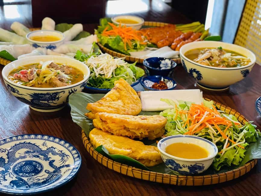 Hue City: Cyclo, Market Tour & Cooking Class at Madam Thu - Crossing the Perfume River by cyclo