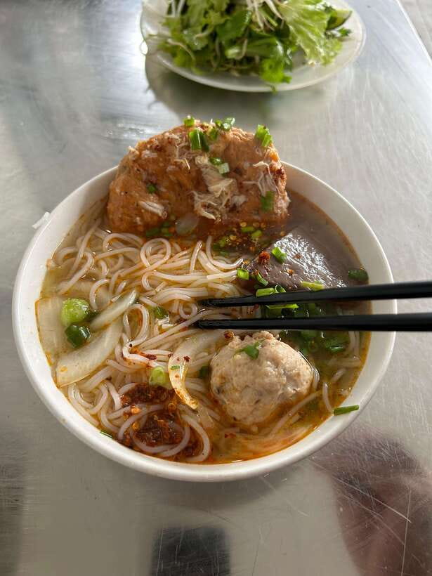Hue: Guided Local Food Tour with Stories - Crossing toward 114 Dinh Tien Hoang