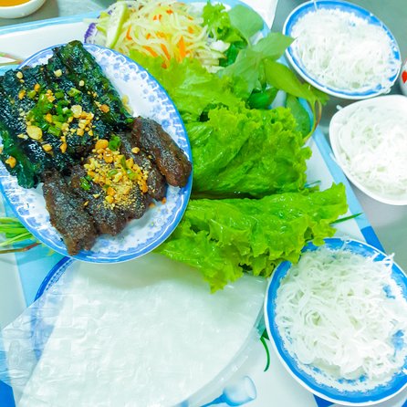 Private Street Food Evening Walking Tour in Ho Chi Minh City - Walking between food stops