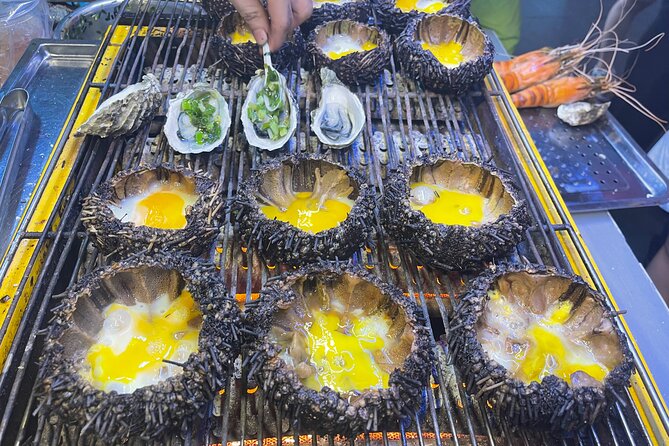 Saigon By Night and Street Food By Motorbike | Opt: Ao Dai Riders - District 4, spring-roll vermicelli, and the final meal