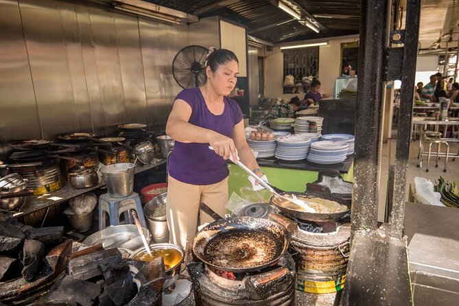 Saigon Night Bites on Foot: Local Vendors, Stories & Sweet Finish - Passing Chua Ba Thien Hau and Ong Lanh Bridge Market