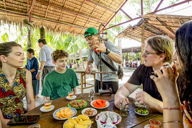 Small-Group Mekong Delta Day Trip: Boat Ride, Cottages & Pagoda - Gardens, bicycles, and the narrow canal ride