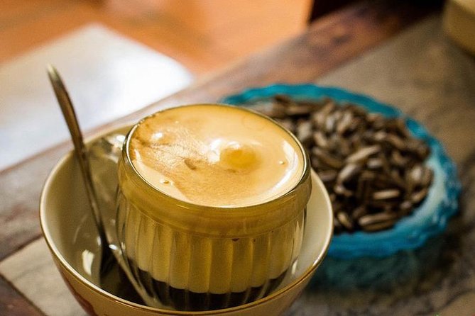Small-Group Street Food Cyclo Tour of Hanoi Old Quarter - Egg coffee in a small café